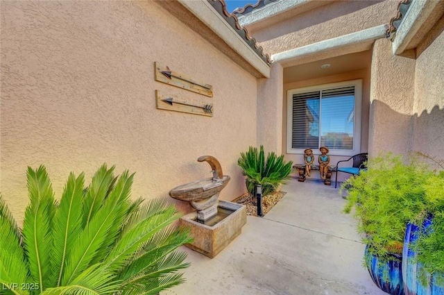 doorway to property with a patio