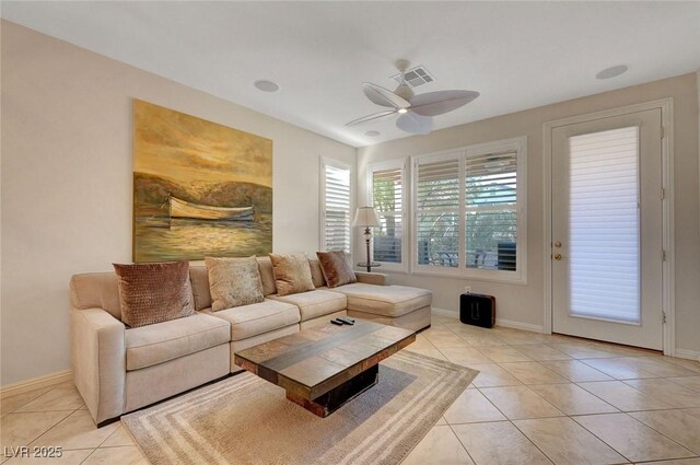 living room with ceiling fan and light tile patterned floors