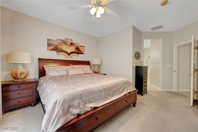 bedroom with ceiling fan and light colored carpet