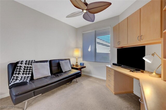 office area with light carpet and ceiling fan