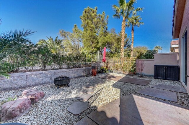 view of patio / terrace featuring a fire pit