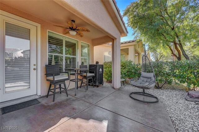 view of patio / terrace featuring ceiling fan