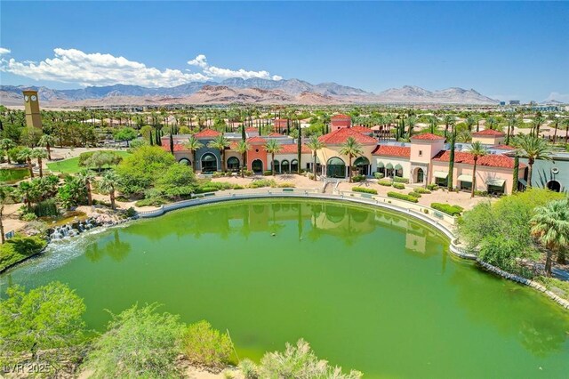 aerial view featuring a water and mountain view