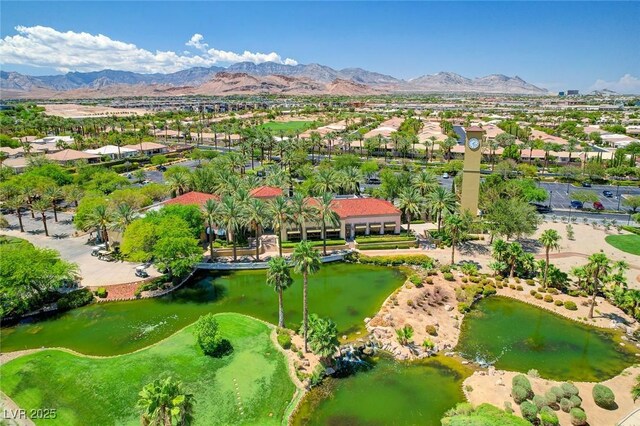 birds eye view of property featuring a water and mountain view