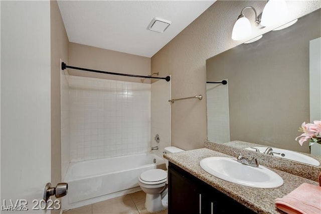 full bathroom with shower / bathtub combination, tile patterned floors, vanity, and toilet