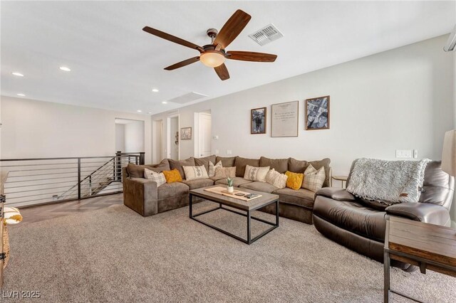 living room featuring ceiling fan and light colored carpet