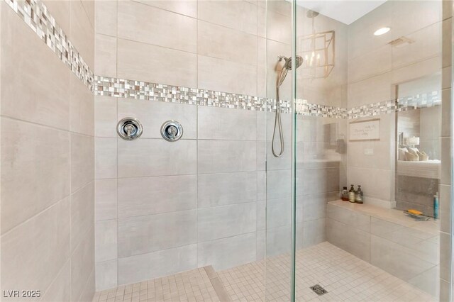 bathroom with a tile shower