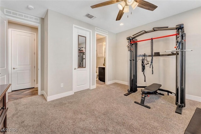 workout room with light carpet and ceiling fan