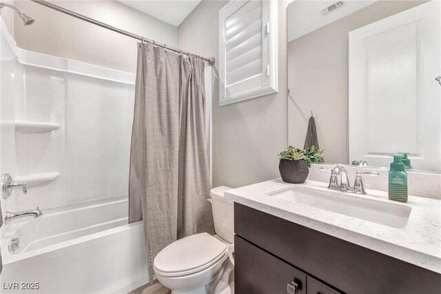 full bathroom with toilet, vanity, and shower / bath combo with shower curtain