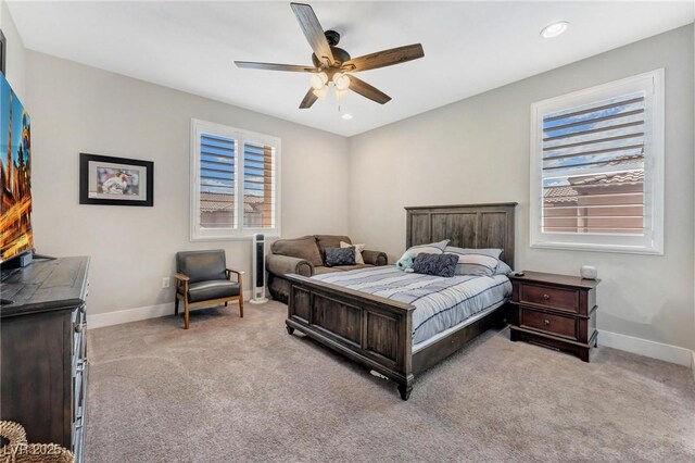 carpeted bedroom featuring ceiling fan