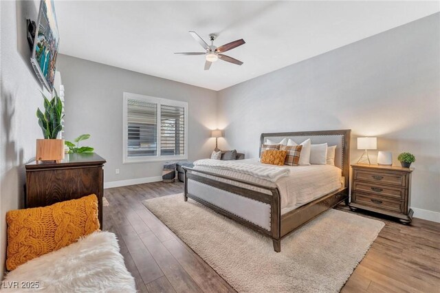 bedroom featuring ceiling fan and hardwood / wood-style flooring