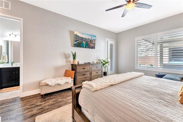 bedroom with ceiling fan, wood-type flooring, and ensuite bathroom