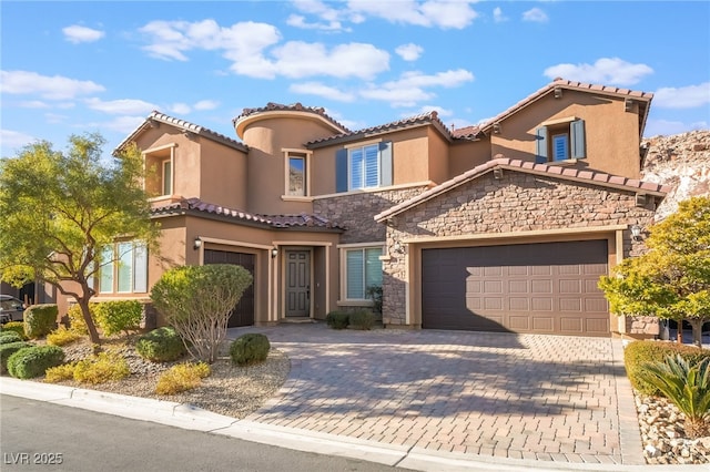 mediterranean / spanish house featuring a garage