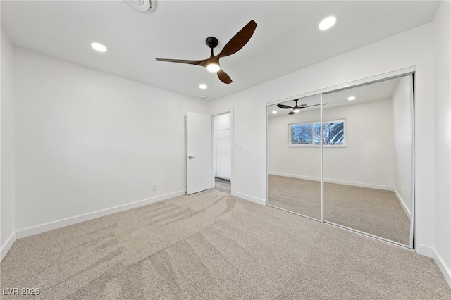 unfurnished bedroom featuring ceiling fan, a closet, and carpet floors