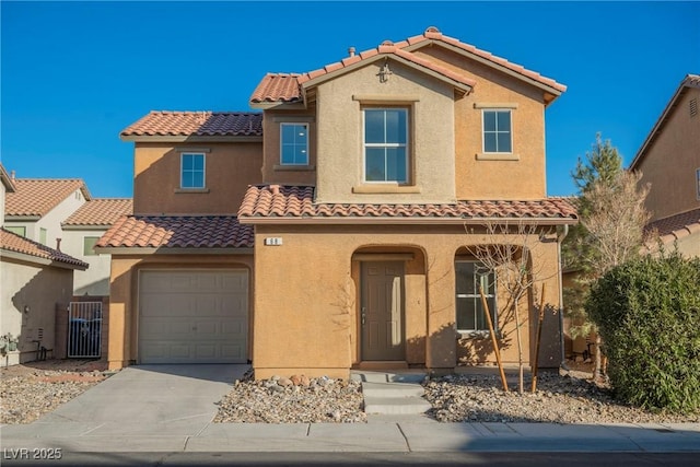 mediterranean / spanish-style home featuring a garage