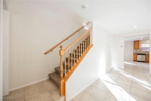 stairway with tile patterned flooring