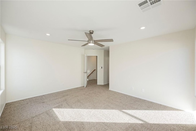 empty room with ceiling fan and carpet