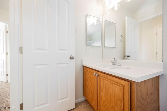 bathroom with tile patterned floors and vanity