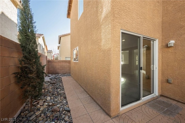 view of side of property with a patio area