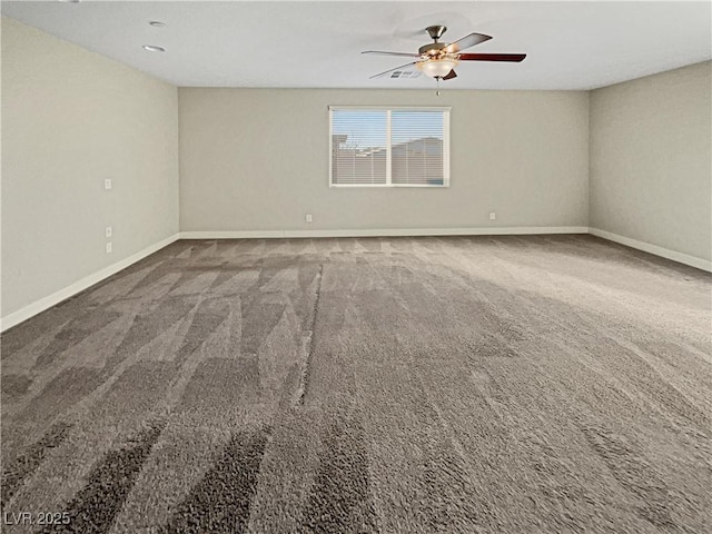 unfurnished room featuring ceiling fan and carpet flooring