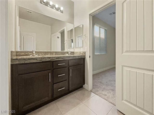 bathroom with vanity and tile patterned flooring