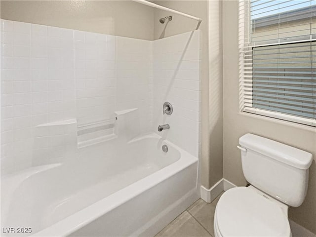 bathroom featuring shower / bath combination, tile patterned floors, and toilet