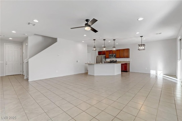 unfurnished living room featuring ceiling fan and light tile patterned floors