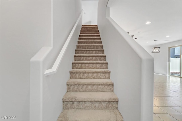 stairs with tile patterned floors