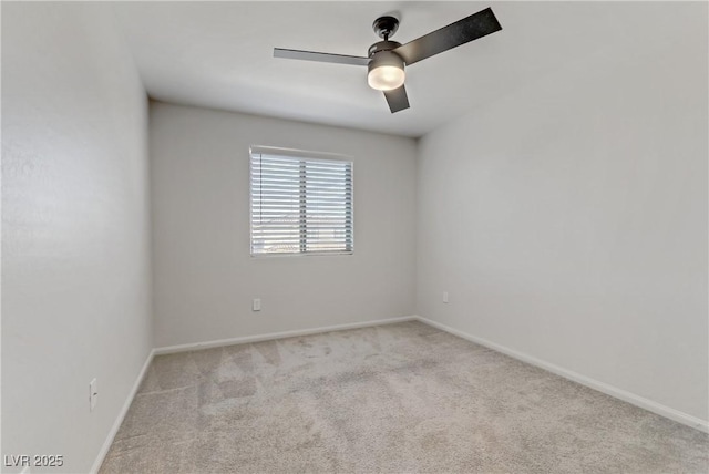 unfurnished room featuring ceiling fan and light carpet