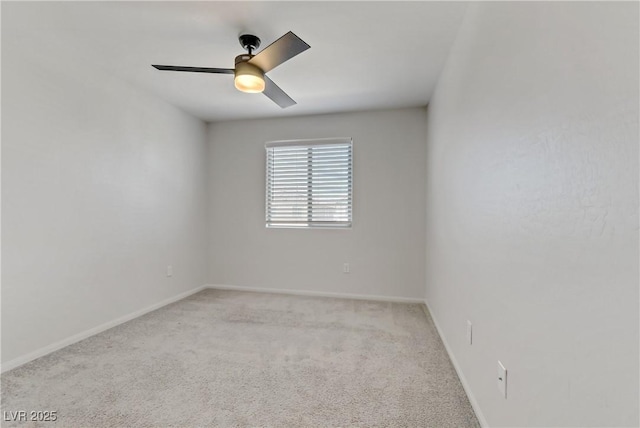 unfurnished room with ceiling fan and light colored carpet