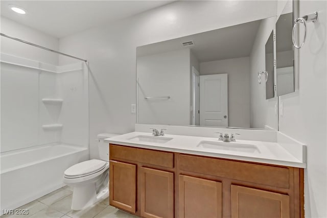 full bathroom with bathtub / shower combination, toilet, vanity, and tile patterned flooring