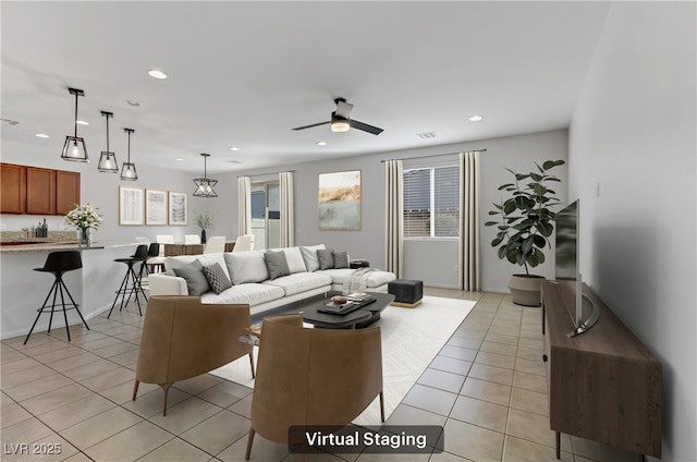 tiled living room featuring ceiling fan