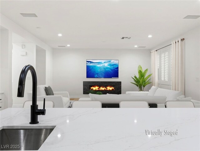 living room with sink and a fireplace