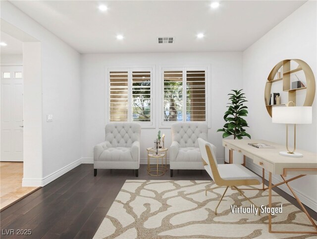 sitting room with dark hardwood / wood-style flooring