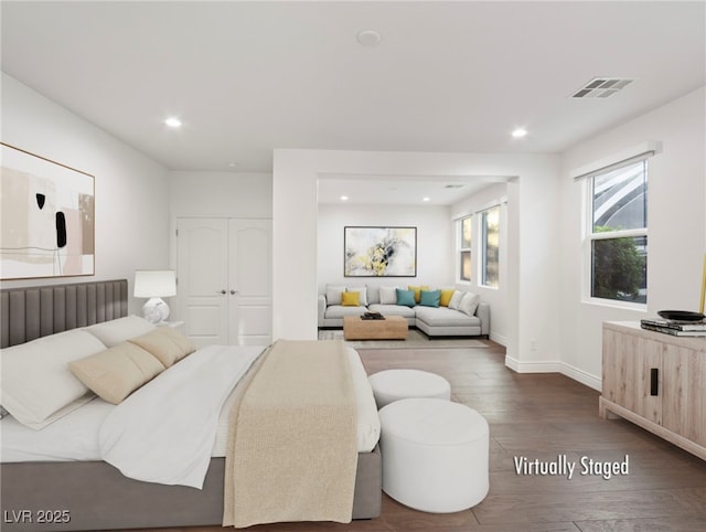 bedroom with dark hardwood / wood-style floors