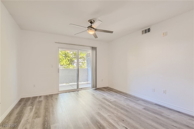 empty room with ceiling fan and light hardwood / wood-style floors