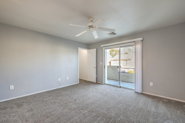 spare room with ceiling fan and carpet floors