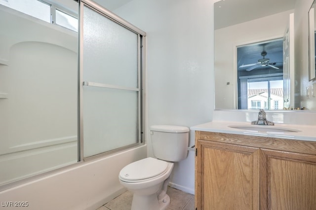 full bathroom with toilet, vanity, tile patterned flooring, ceiling fan, and enclosed tub / shower combo