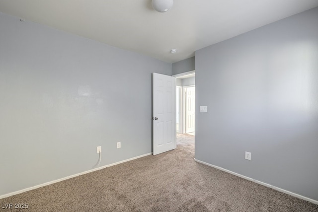 spare room featuring carpet floors