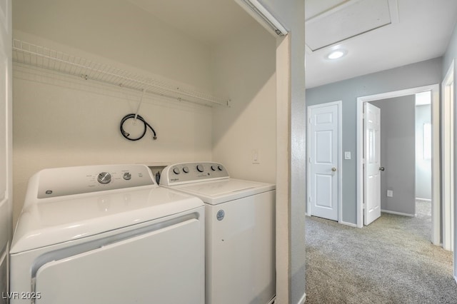 laundry area with light carpet and separate washer and dryer