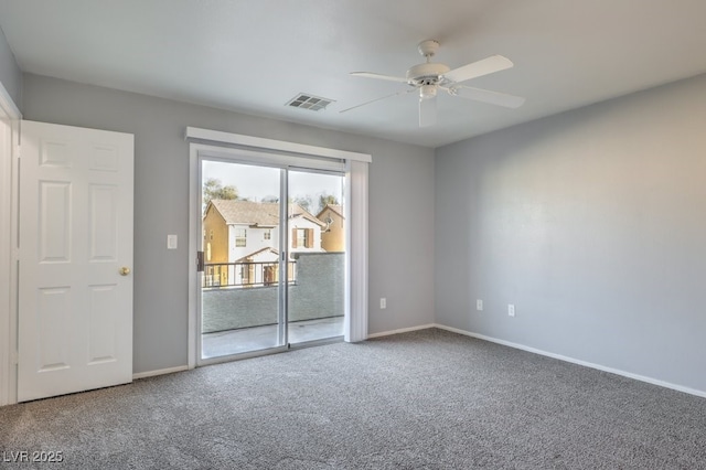 carpeted empty room featuring ceiling fan