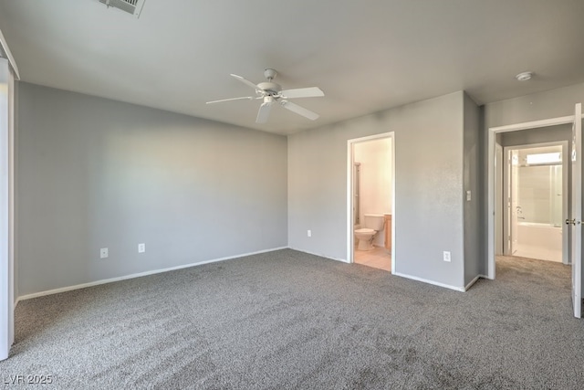 unfurnished bedroom featuring ceiling fan, light carpet, and ensuite bath