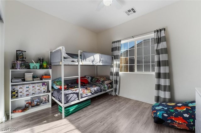 bedroom featuring ceiling fan and hardwood / wood-style floors