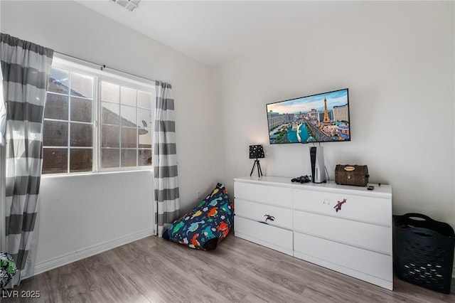 bedroom with light hardwood / wood-style flooring