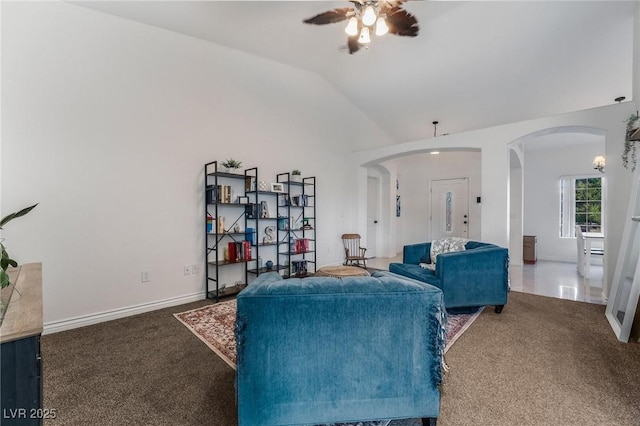 living room with ceiling fan, lofted ceiling, and dark carpet