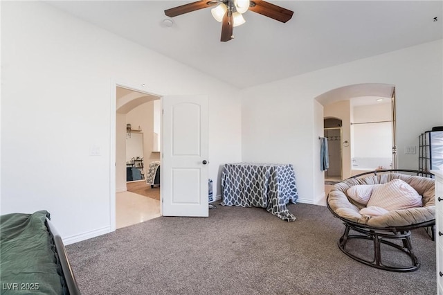 sitting room featuring ceiling fan and carpet