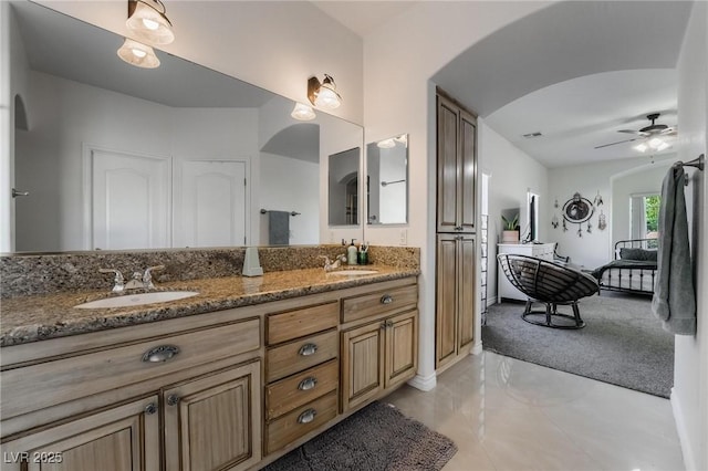 bathroom featuring ceiling fan, tile patterned floors, and vanity