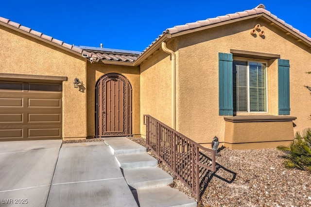 property entrance featuring a garage