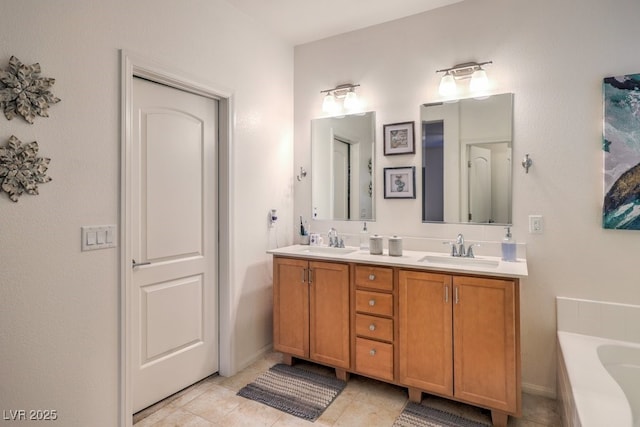 bathroom with vanity, a washtub, and tile patterned floors