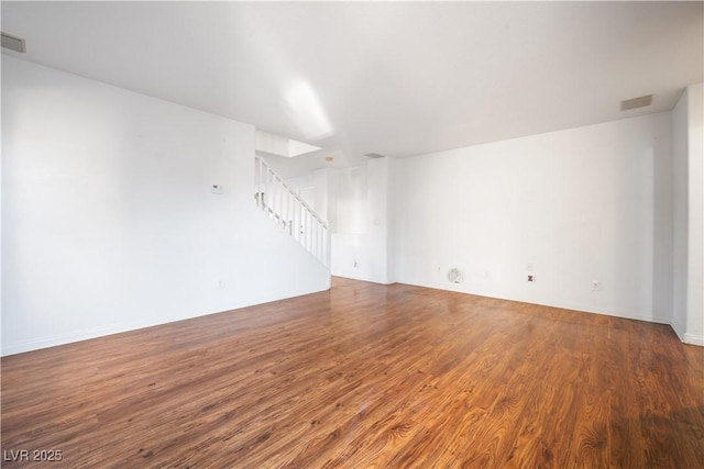 unfurnished room with wood-type flooring